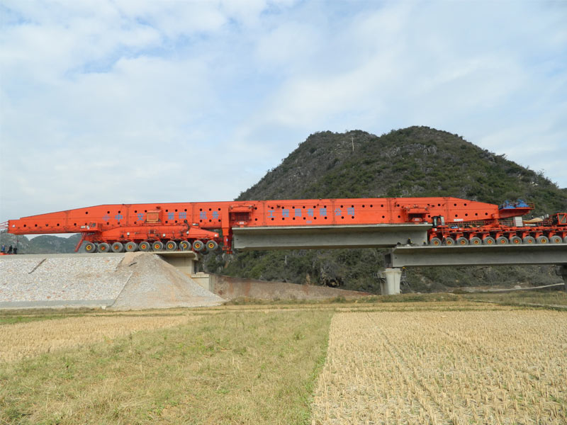 Box girder beam launcher for girder carrying and erecting